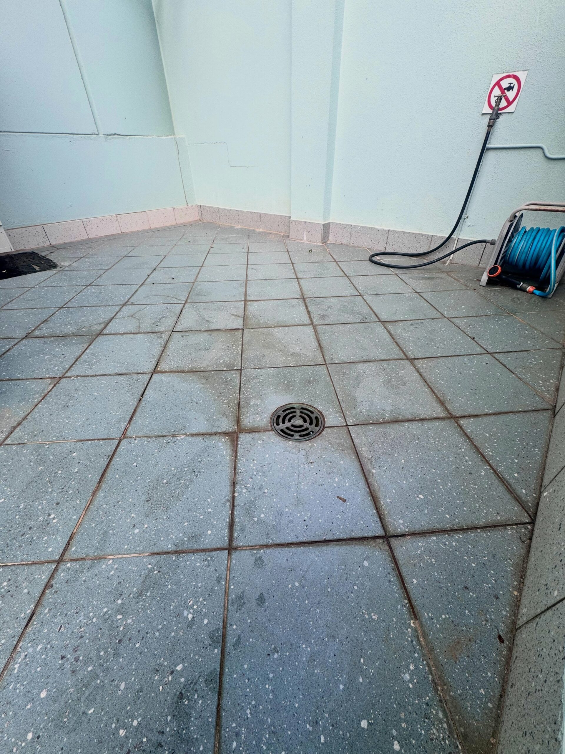 First photo of a regrouting of a balcony in Crawly before the job has been completed