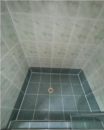 Shower base after regrouting in a Perth home with clean, fully sealed grout lines