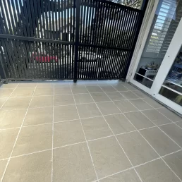 After photo of tiles that have been regrouted and cleaned looking brand new.